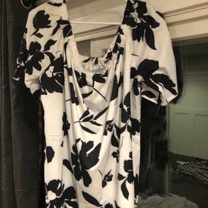 3 black & white short-sleeve shirts, 2 are stripes 1 is flowered/Hawaiian print